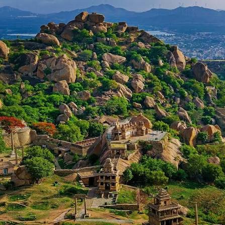 Massive ancient stone walls winding through rocky hills