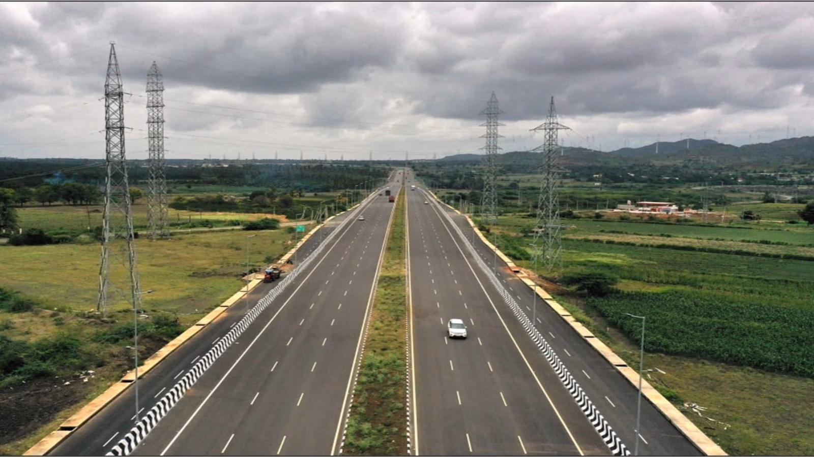 A wide, flawless multi-lane highway stretching into the horizon