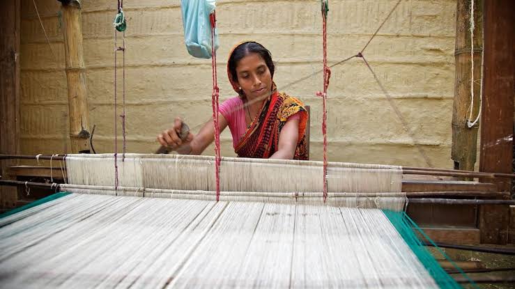Close up of traditional Indian handloom weaving colorful threads